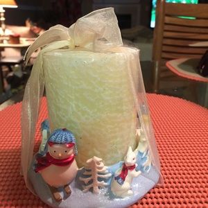 Snowman candle holder and candle.